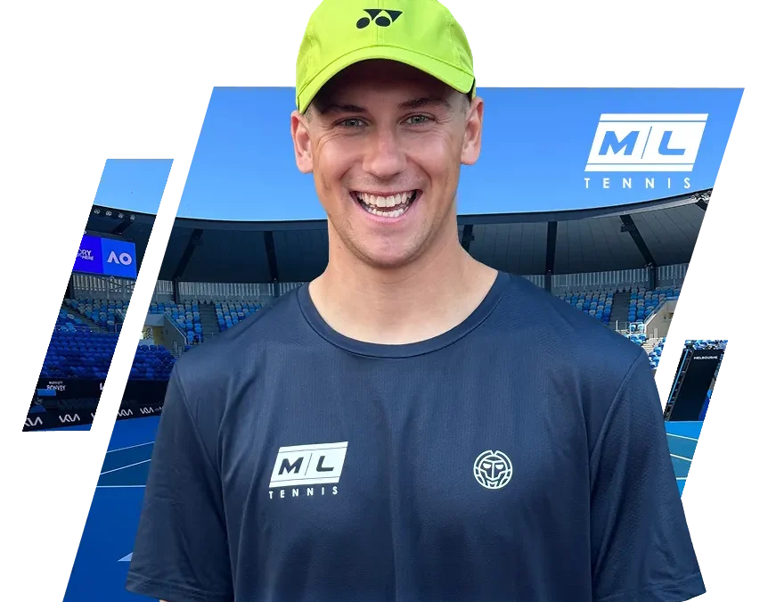 Smiling young man wearing a neon yellow Yonex tennis cap and an ML Tennis branded shirt in a large tennis stadium with blue s
