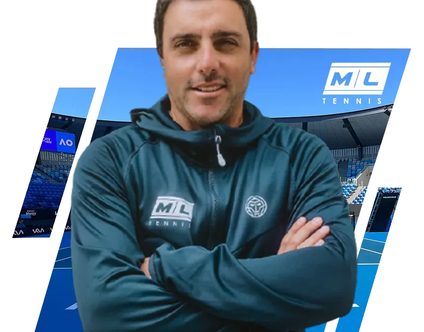 Man in blue ML Tennis jacket standing with arms crossed on tennis court